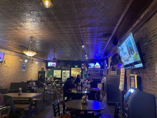 Area of bar, sitting are and kitchen