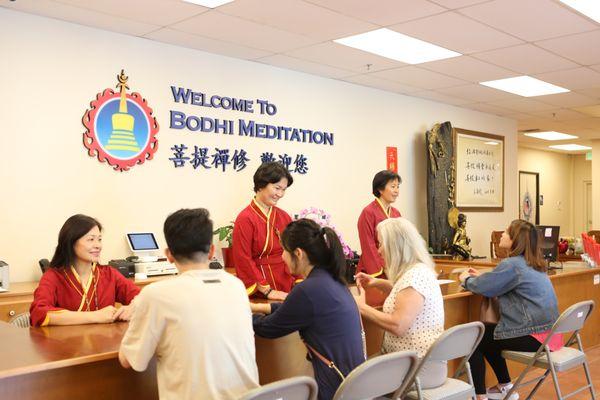 Students ask questions at the front desk