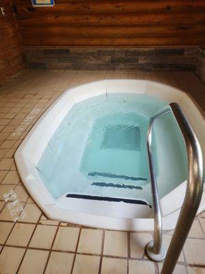 The indoor whirlpool which wasn't full, & was dirty.