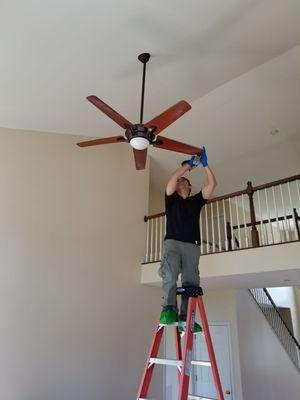 Ceiling fan dusting.