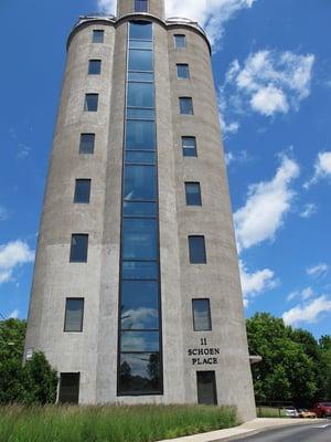 Each of 9 floors holds approx 1,600 sqft of office space, a glass elevator overlooking the village, and offices have curved walls.