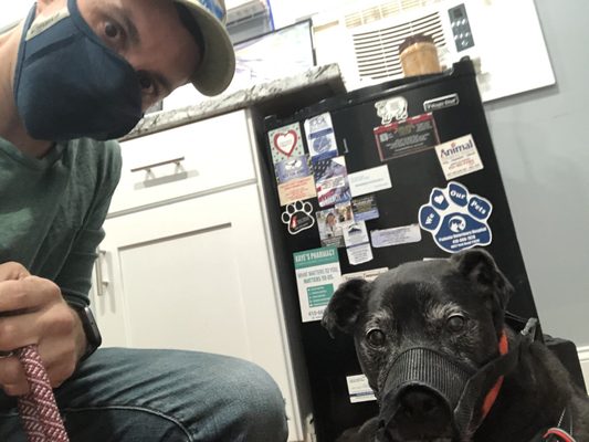 Me and my friend calmly waiting for the Dr. He's an old dog who usually hates vets, that's why we keep the muzzle on for visits.