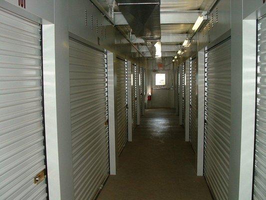 Storage space with indoor access and convenient roll-up doors.