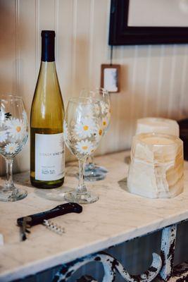 Elevate Your Wine Game with Signor's Exquisite Wines Paired Perfectly with Hand-Painted Glassware from Joanna's Market.