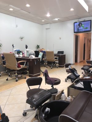 Very bright, lots of windows in front, average nail salon with really nice people working here. Very thorough. Great massage chairs.