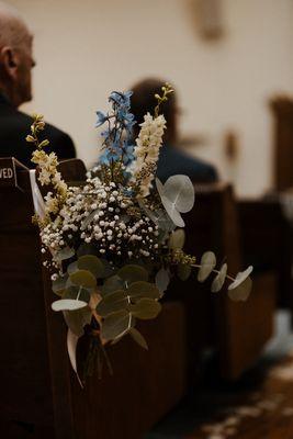 Aisle decor attached to church pews