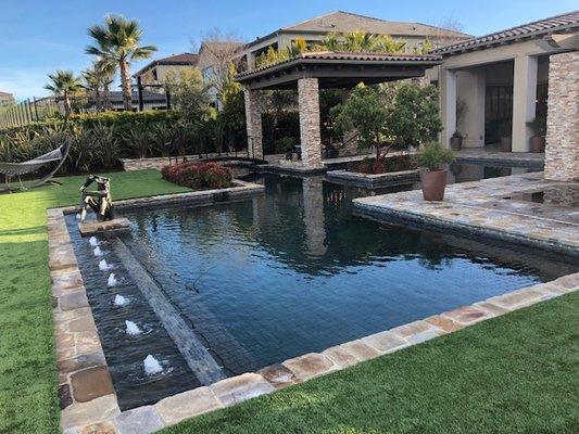 Luxury pool with fountains and spa.