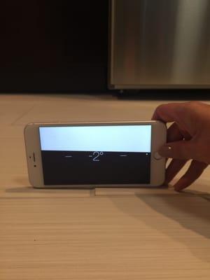 Showing the difference in levels using the iPhone level.