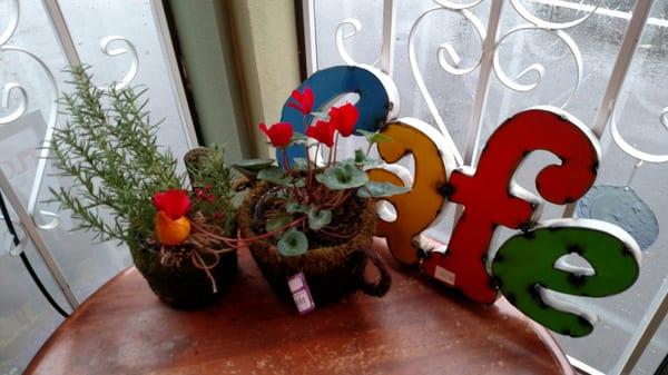 Flowers and rosemary from the nursery next door, art from Mexico.