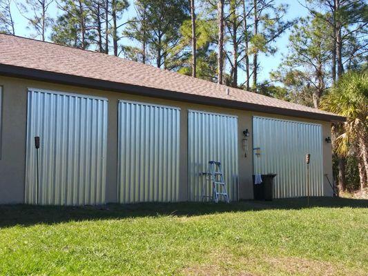 Lanai enclosed by storm panels