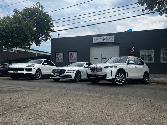 Luxury vehicles parked in front of Metro Motor auto body shop and collision repair center