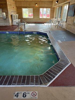 Pool with hot tub in background.