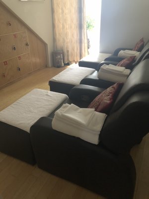 Reflexology chairs in new, clean space with bamboo floors