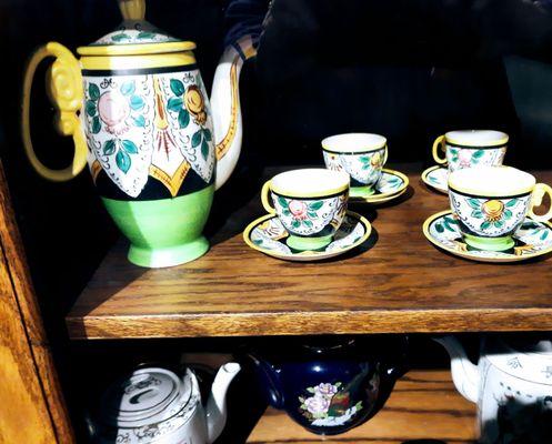 Someone's tea pot collection on display