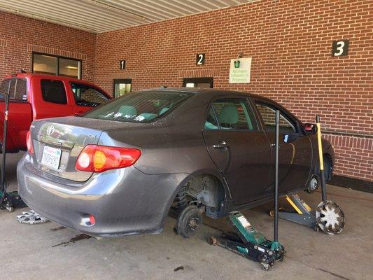 They let you drive your car into the outside bays and they do the rest.