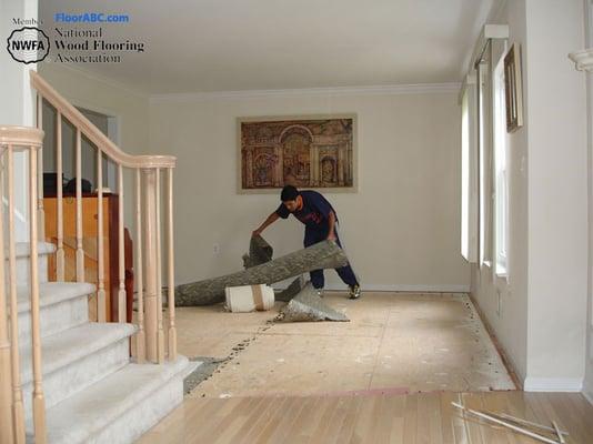 removing carpet to install prefinished hard wood flooring