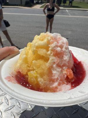 Strawberry and mango shave ice with strawberry puree, sour patch kids, and condensed milk