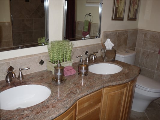 New Pine cabinets with Kashmere Granite top and tiled wainscoating.