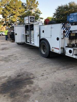 City of Houston employees changed oil in the parking lot