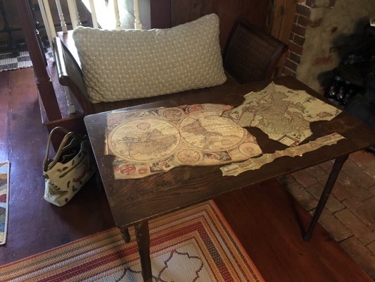 This folding table was perfect for my tiny kitchen. I added the maps myself. The bench also came from Restore, $5.00 each.