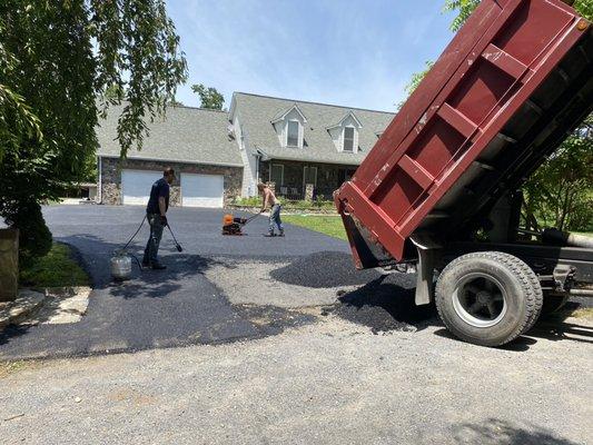 Finishing up new asphalt installation