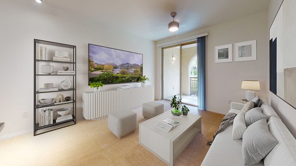 Staged living room with ceiling fan, carpet, and sliding glass balcony door.