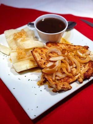 Bistec de pollo encebollado with Yuca garlic and Black beans (very popular for dining and to go, we do not add meat or water from a bottle!