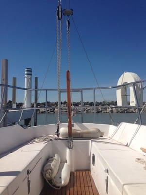 View from sailboat at a dock.