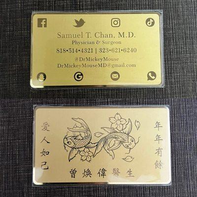 Brass business card with engraved designs