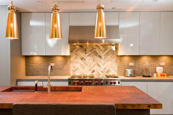 Modern kitchen with real hammered copper countertops and herringbone tile