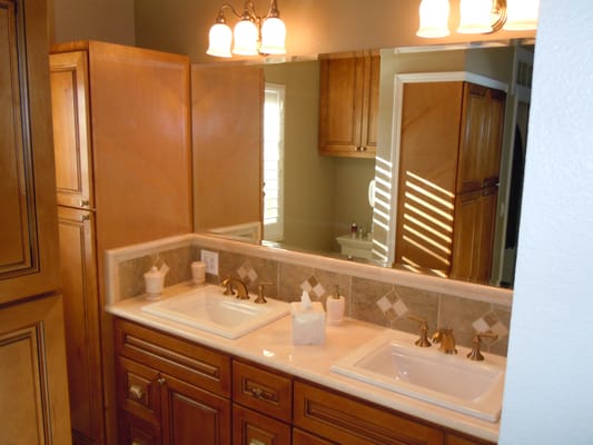 Cinnamon cabinets with soft close features and Crema Marfil marble top.