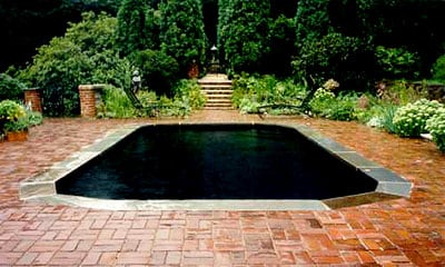 Brick patio, blue stone pool coping.