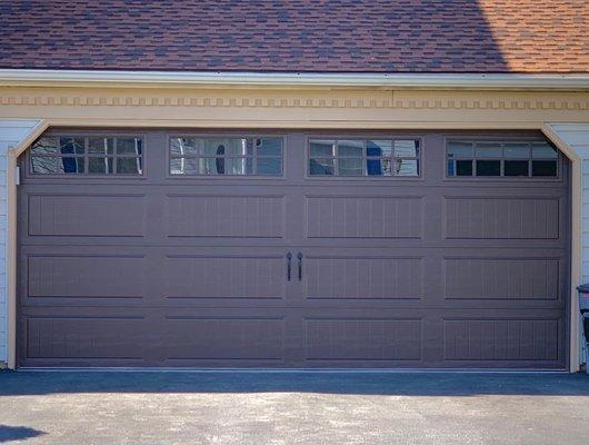 Chocolate brown carriage style door.