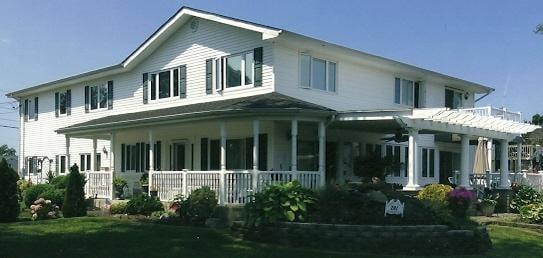 Installed windows, siding, roof, built porch, portico railing on this home in West Islip