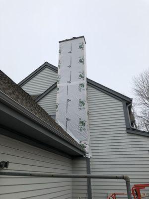 Siding removed, house wrap installed