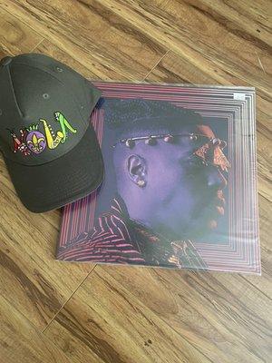 NOLA baseball cap by local artist and Axiom live double album by Christian Scott Atunde Adjuah