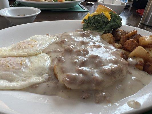 Sausage gravy and biscuits with eggs, home fries