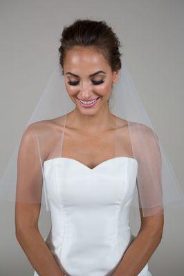 This veil has a clean edge finish and is elbow length.