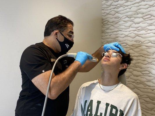 Stephen Oscar getting laser genesis treatment from Dr. Lahijani in the Beverly Hills office | June 2021