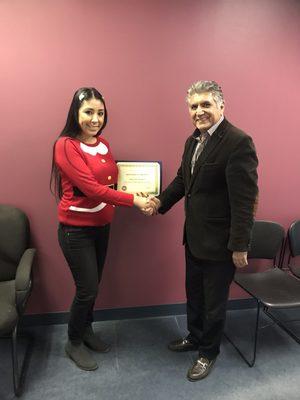 Graduate receiving her certificate