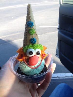 non-regulation clown cone... why is his face on his hat??? XD