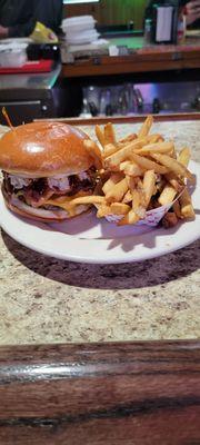 Zing Zang burger with slaw, cheddar, bacon, and an Asian style sauce on brioche.