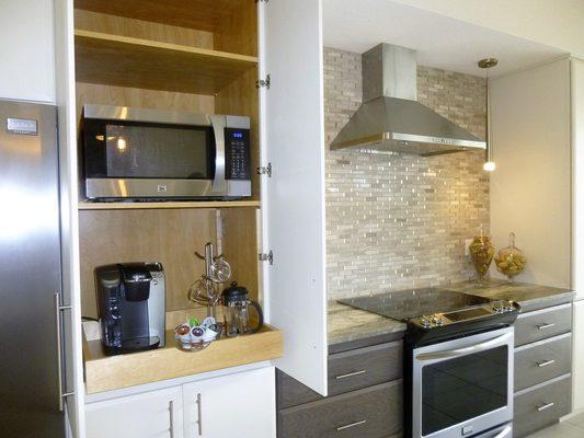 Convenient and concealed coffee station in this StarMark kitchen