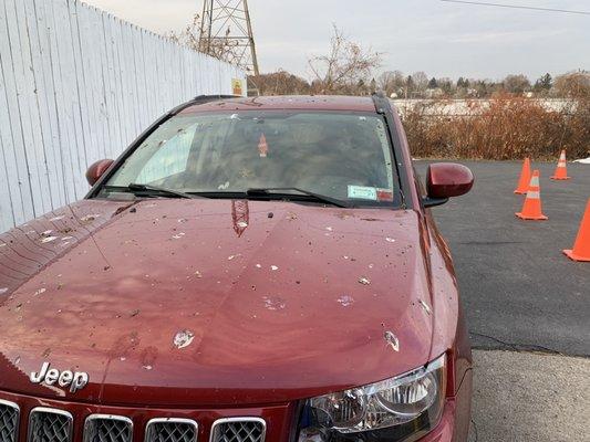 Before picture of red Jeep Cherokee