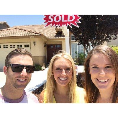 Happy new owners with Meridox Agent, Ashley Daniels.