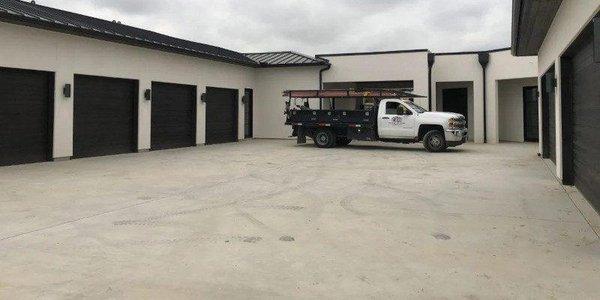 WE OFFER COMPREHENSIVE COMMERCIAL GARAGE DOOR SERVICES.