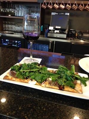 Sitting at the bar in the Market cafe. It is the steak and arugula salad flatbread. Very delish!