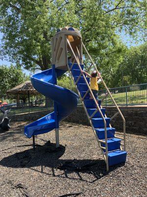 Very high curly slide--and a 2 year old with no fear!