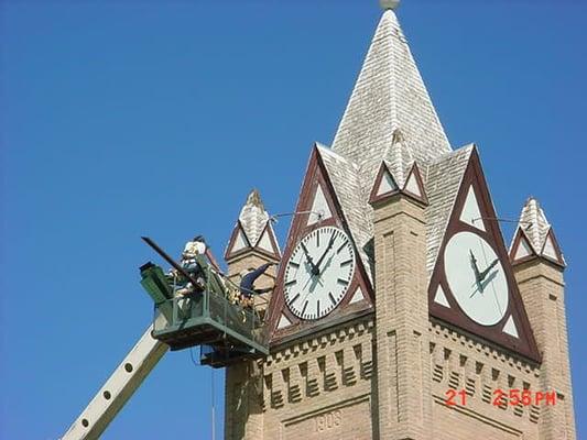 Guy's working on a steeple. They are about 110' up installing the new roof over old shakes that were painted.