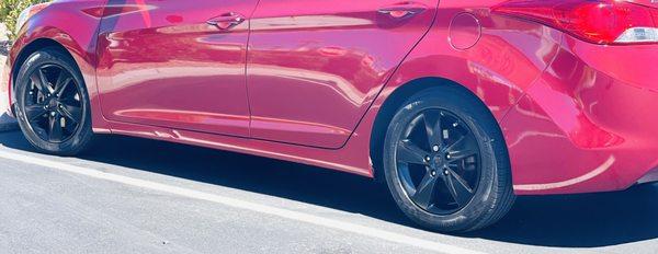 Another angle of factory rims painted shinny black